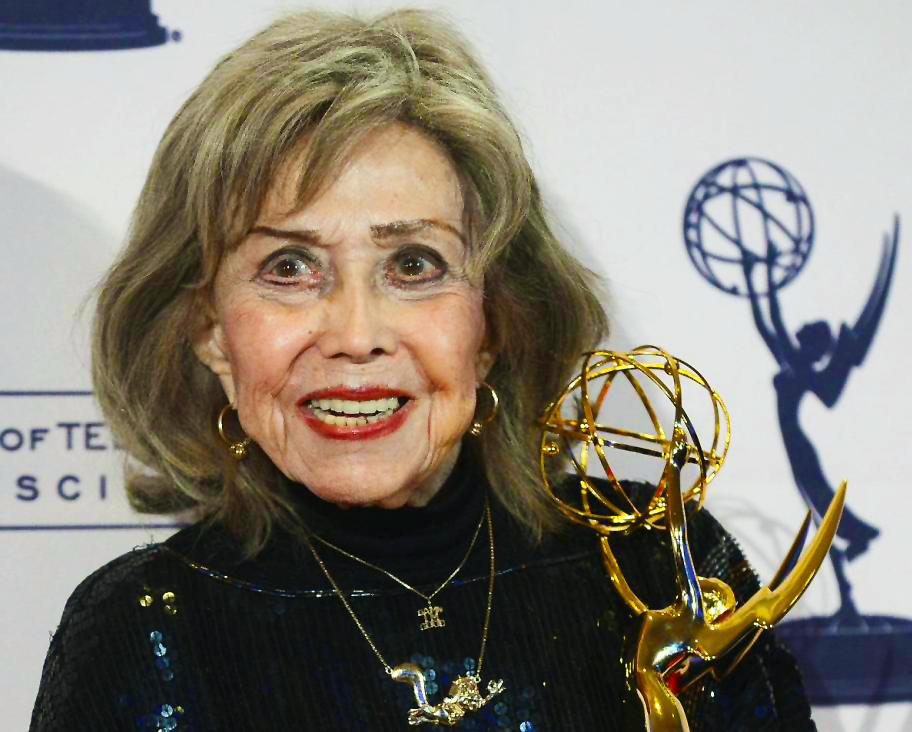 June Foray is posing for the press at the 2013 Emmy Awards after receiving her first and long overdue Emmy Award.